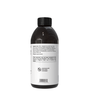 A dark amber bottle with a black cap and a white label, photographed from the back against a plain white background.